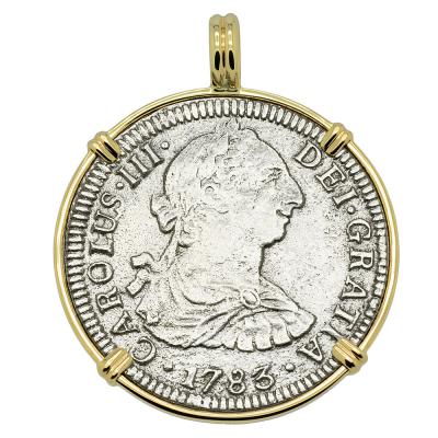 El Cazador treasure coin in gold pendant