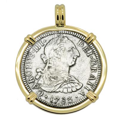 El Cazador treasure coin in gold pendant