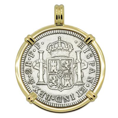 El Cazador treasure coin in gold pendant