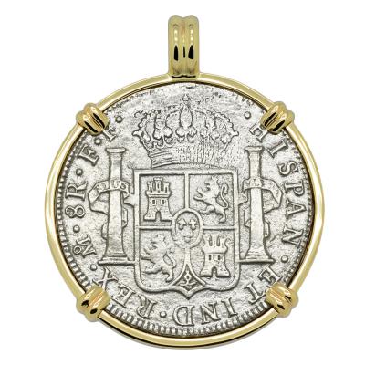El Cazador treasure coin in gold pendant
