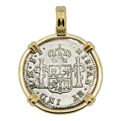 El Cazador treasure coin in gold pendant