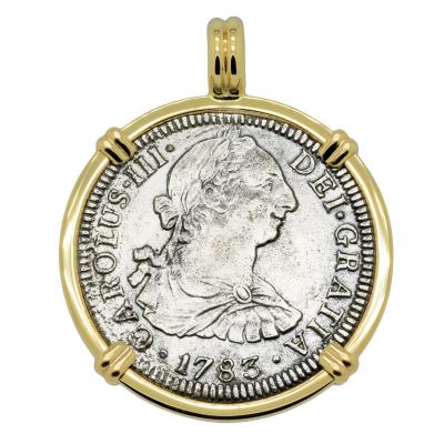 El Cazador treasure coin in gold pendant