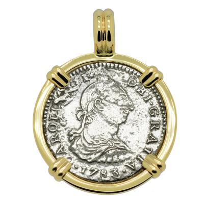 El Cazador treasure coin in gold pendant