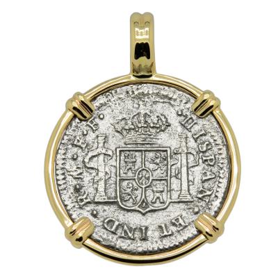 El Cazador treasure coin in gold pendant