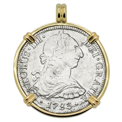 El Cazador treasure coin in gold pendant