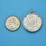 Pendant size next to a Quarter