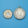 Pendant size next to a Quarter