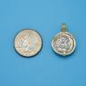 Pendant size next to a Quarter