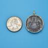 Pendant size next to a Quarter