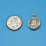 Pendant size next to a Quarter