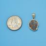 Pendant size next to a Quarter