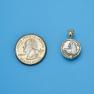 Pendant size next to a Quarter