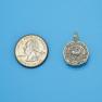 Pendant size next to a Quarter