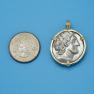 Pendant size next to a Quarter