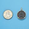 Pendant size next to a Quarter