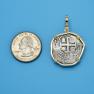 Pendant size next to a Quarter