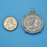 Pendant size next to a Quarter
