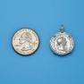 Pendant size next to a Quarter