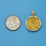 Pendant size next to a Quarter