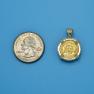 Pendant size next to a Quarter