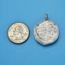 Pendant size next to a Quarter