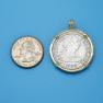 Pendant size next to a Quarter