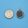 Pendant size next to a Quarter
