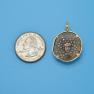 Pendant size next to a Quarter