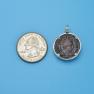 Pendant size next to a Quarter