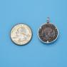 Pendant size next to a Quarter