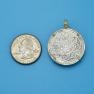 Pendant size next to a Quarter