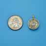 Pendant size next to a Quarter