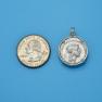 Pendant size next to a Quarter