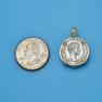 Pendant size next to a Quarter