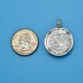 Pendant size next to a Quarter