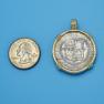 Pendant size next to a Quarter