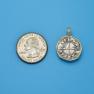 Pendant size next to a Quarter