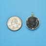 Pendant size next to a Quarter