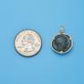 Pendant size next to a Quarter