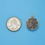 Pendant size next to a Quarter