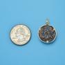 Pendant size next to a Quarter
