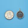 Pendant size next to a Quarter