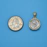 Pendant size next to a Quarter