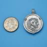 Pendant size next to a Quarter