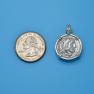 Pendant size next to a Quarter