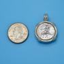 Pendant size next to a Quarter
