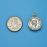 Pendant size next to a Quarter