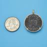 Pendant size next to a Quarter