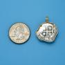 Pendant size next to a Quarter