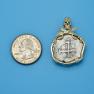 Pendant size next to a Quarter
